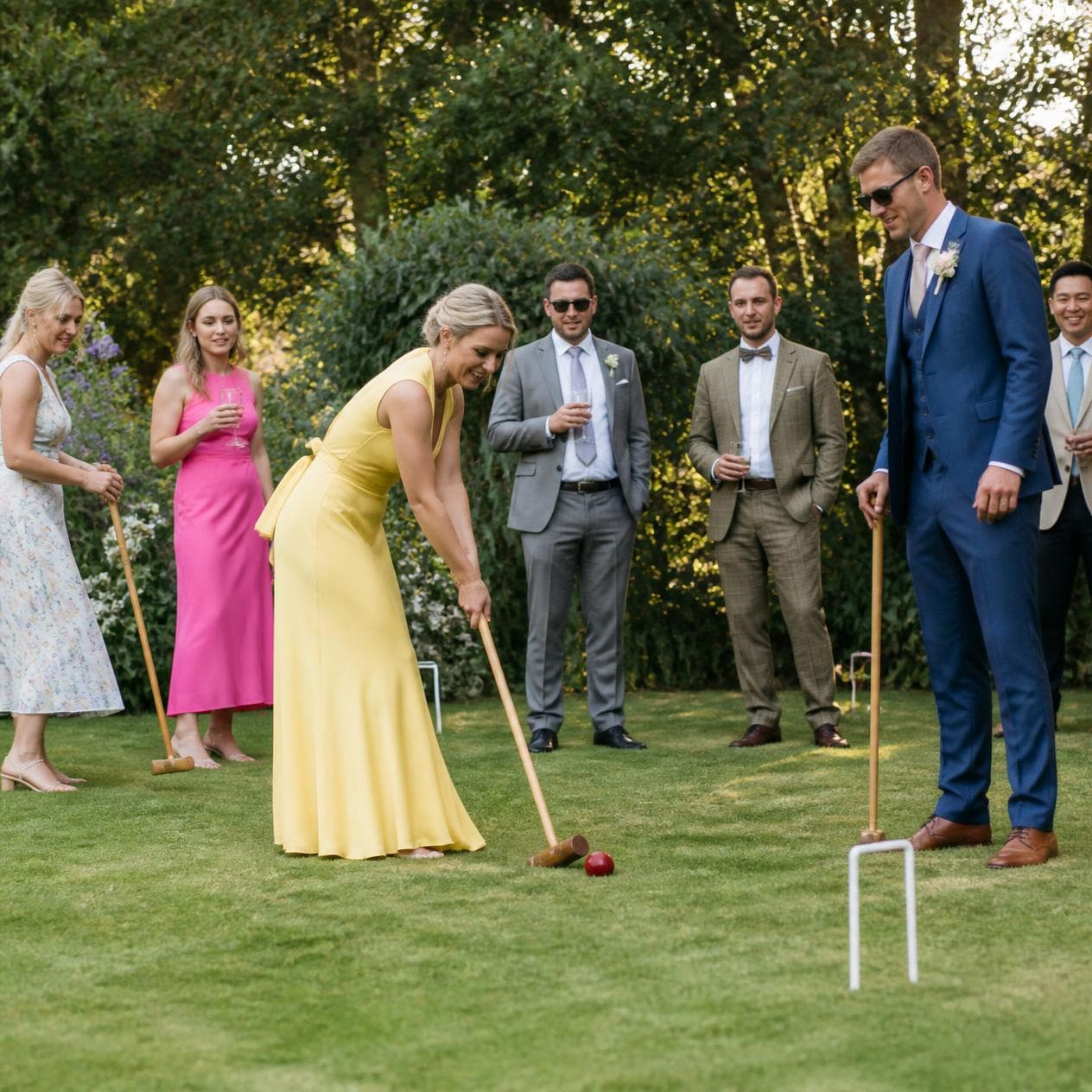 LoveLark Events lawn croquet hire — wedding guests playing on estate grass